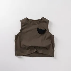 Close-up of kids breathable cotton tank top with a decorative dark semi-circular pocket
