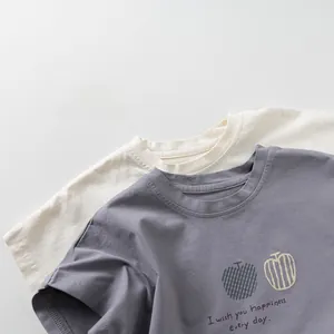 Detail of soft cotton crew neck t-shirts with printed apple patterns and text