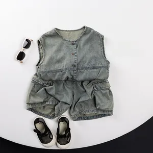 Flat lay of kids vintage washed denim cargo shorts and buttoned vest with side pockets