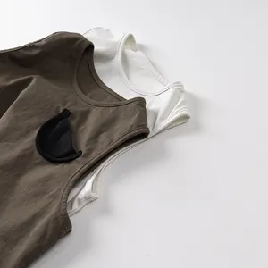 Detail of soft cotton breathable kids tank tops with cute cat ear pockets and clean stitching