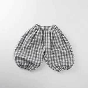 Detail of grey gingham kids harem pants with elastic waist and gathered cuffs
