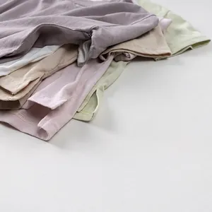 Kids minimalist cotton short sleeve t-shirts stacked in soft summer pastel colors