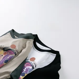 Close-up of crew neck and colorful cartoon prints on raglan sleeve kids' cotton t-shirts