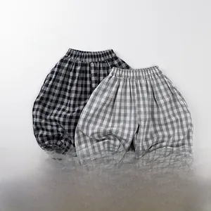 Detail of lightweight kids plaid anti-mosquito pants with elastic waist and cuffs