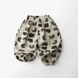 Close-up of breathable double-layer cotton gauze baby pants with geometric patterns