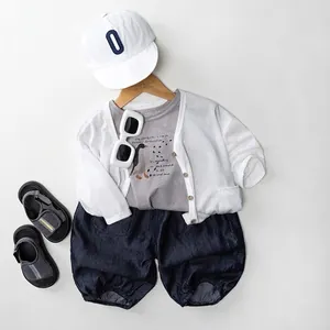 Kids casual summer cotton set featuring gray t-shirt, white cardigan and navy shorts