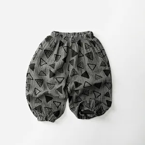 Detailed texture of cotton gauze mosquito pants featuring gray geometric triangle patterns