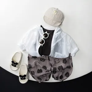 Toddler summer outdoor outfit featuring a white hooded sun protection jacket and accessories