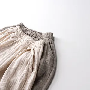 Detail of breathable cotton linen texture and elastic waistband on casual toddler pants