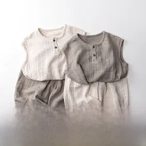 Close-up of cotton linen fabric texture and wooden buttons on kids sleeveless top