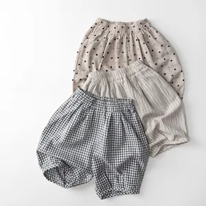 Detailed flat lay of toddler cotton linen shorts with polka dots, stripes and plaid patterns