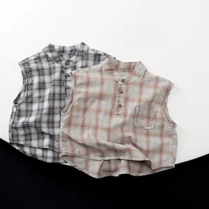 Flat lay of sleeveless plaid shirts with mandarin collar and pocket detail for kids