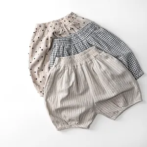 Detailed view of kids cotton linen shorts with polka dots, plaid and striped patterns
