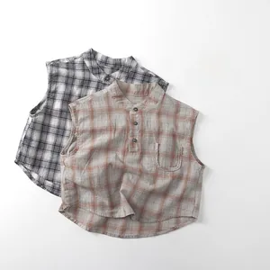 Detailed view of sleeveless plaid cotton shirts in black-white and vintage brown colors