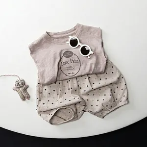 Kids linen cotton sleeveless t-shirt and polka dot shorts set in light brown summer style