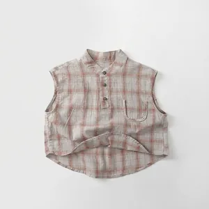 Close-up of kids plaid sleeveless shirt featuring a mandarin collar and small front pocket