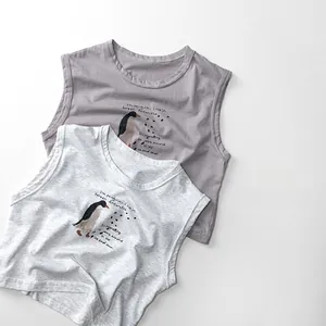 Detail of soft cotton kids tank tops in grey and purple with cute penguin print