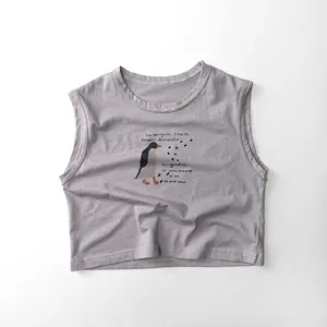 Detailed view of kids grey cotton vest featuring a hand-drawn penguin print design