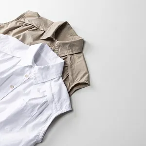 Chemises sans manches en coton pour enfants en blanc et beige avec cols à revers