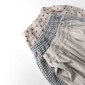 Detailed view of kids cotton linen shorts featuring elastic waist and textured fabric