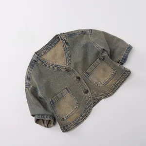 Macro shot of retro washed denim vest with V-neck, brown buttons and large pockets