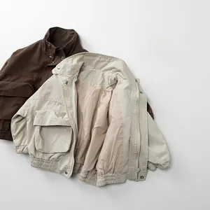 Detailed flat lay of kids utility cotton jackets in dark brown and light beige colors