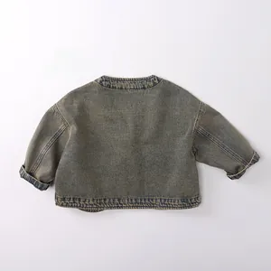 Back view of a vintage yellow-washed denim jacket for kids featuring dropped shoulders