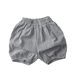 Kids black and white checkered linen lantern shorts with elastic waist and bubble hem