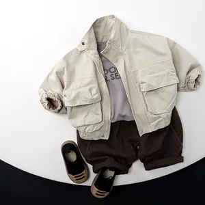 Kids beige cotton utility jacket with brown pants and sneakers outfit set for spring