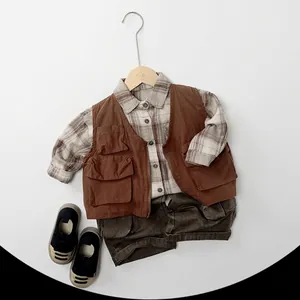 Retro autumn kids' workwear outfit with brown multi-pocket vest and plaid shirt