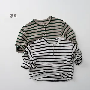 Close-up of kids striped long sleeve shirts with buttoned Henley neck and soft knit texture