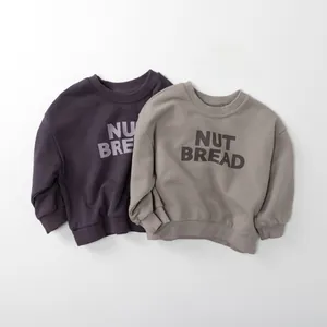Detail of ribbed cuffs and Nut Bread print on casual cotton sweatshirts for kids