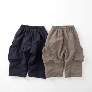Detailed view of kids cargo shorts set in navy and khaki with functional zipper pockets