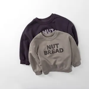 Detail of ribbed cuffs and crew neck on premium cotton long sleeve kids sweatshirts