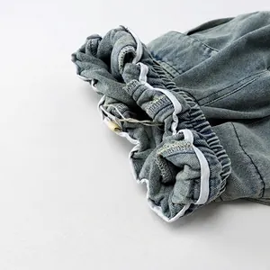 Kids casual denim trousers with elastic waistband and light blue wash detail