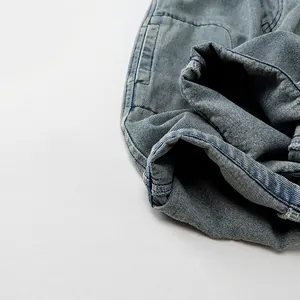 Kids casual loose denim pants in light blue wash featuring utility cargo style