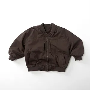 Detail of dark brown cotton flight jacket with ribbed collar, cuffs and front zip closure