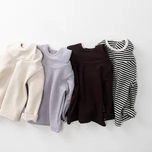 Flat lay of soft cotton long-sleeved thermal shirts in beige, purple, and striped colors