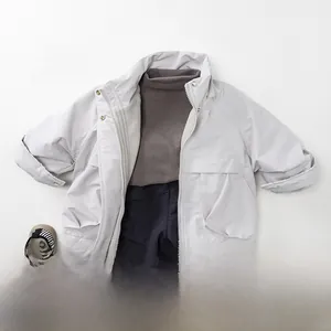 Flat lay of gray outdoor fleece jacket with navy quilted thermal pants for kids
