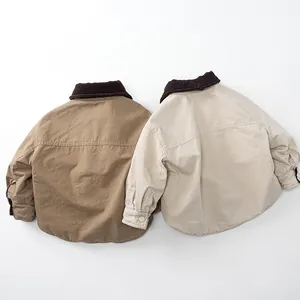 Detail of reversible fleece-lined jacket with corduroy collar and cargo buttoned cuffs