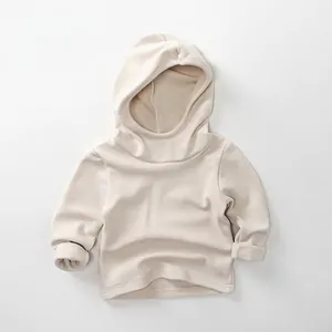 Close-up of soft beige fleece hooded sweatshirt for kids with premium fabric texture