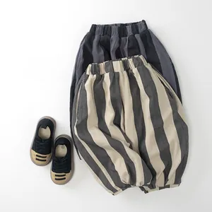 Detailed flat lay of striped fleece-lined trousers for kids with elastic waistband