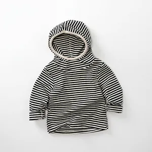 Detail of children's hooded long sleeve top with black and white stripes and ribbed cuffs