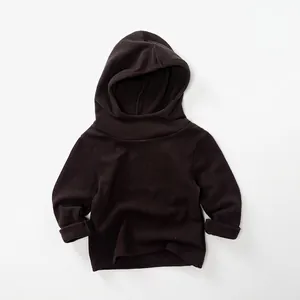 Detail of soft dark coffee fleece lining and ribbed cuffs on kids' hooded sweatshirt
