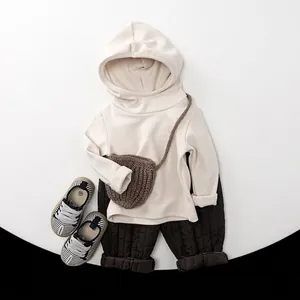 Kids winter outfit set featuring beige hoodie and coffee brown quilted warm trousers