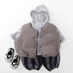 Kids winter set with fleece striped pants, puffer vest and grey hoodie on white background