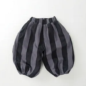Detail view of children's fleece-lined striped balloon pants with elastic waistband