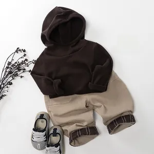 Toddler coffee brown hooded sweatshirt and khaki casual pants outfit with striped shoes