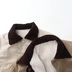 Detail of children fleece jacket featuring corduroy collar and soft sherpa lining