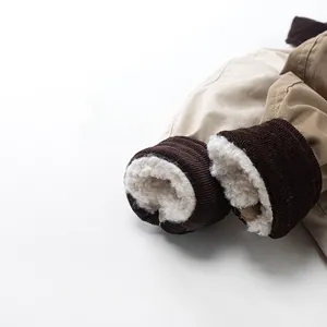 Detail of kids reversible winter pants featuring warm sherpa lining and corduroy hem cuff